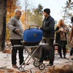 Napoleon TQ285X-RD-1-A TravelQ 285 Portable Grill With Scissor Cart, Propane 9 Napoleon TQ285X-RD-1-A TravelQ 285 Portable Grill With Scissor Cart, Propane -Smokey Ridge Grills Shop tq285x muskoka lifestyle people grilling bl